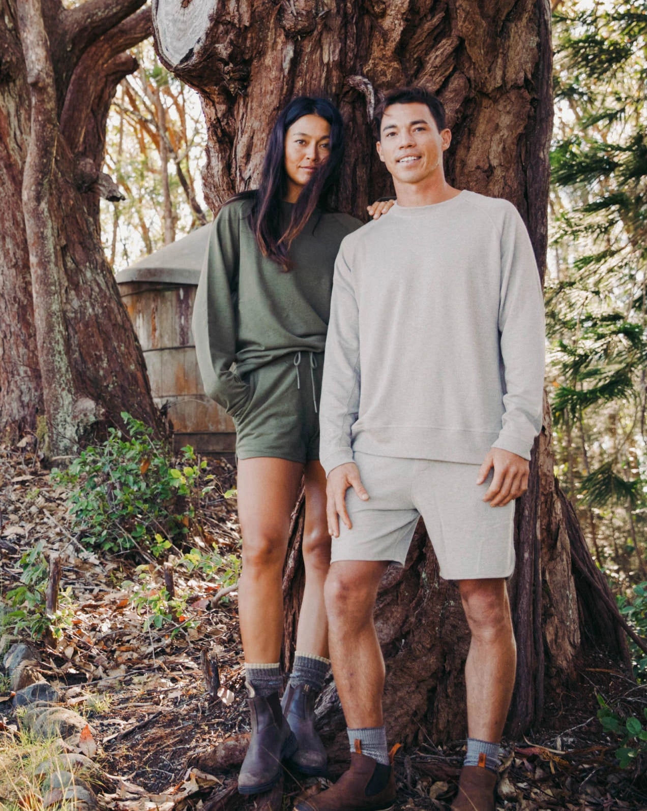 A couple standing in the nature, wearing our alpaca Terry garments 