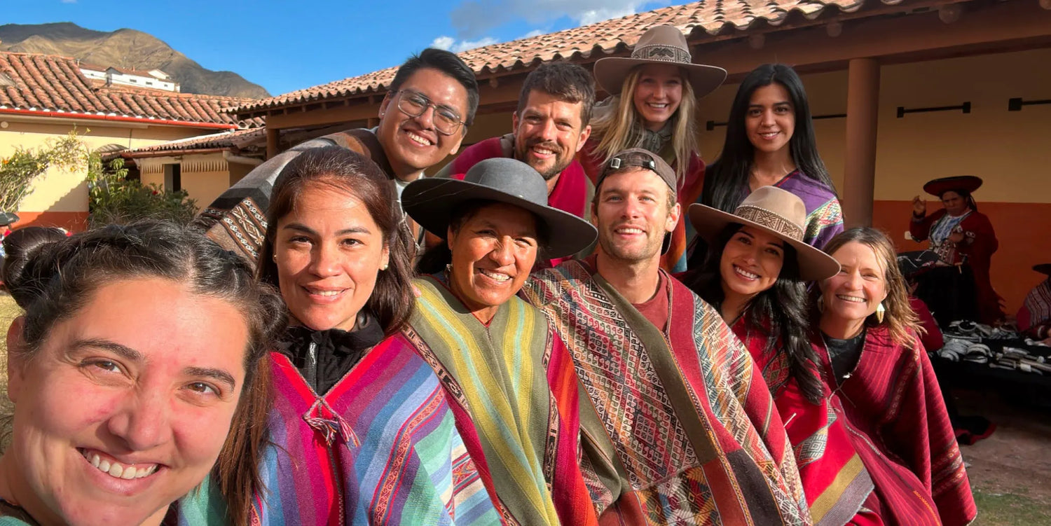 Paka team mates surround Nilda the Weaver