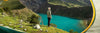 Man overlooking brilliant blue lake wearing alpaca base layer 