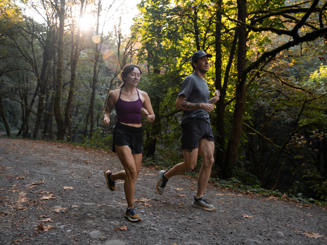 A couple jogging outdoors