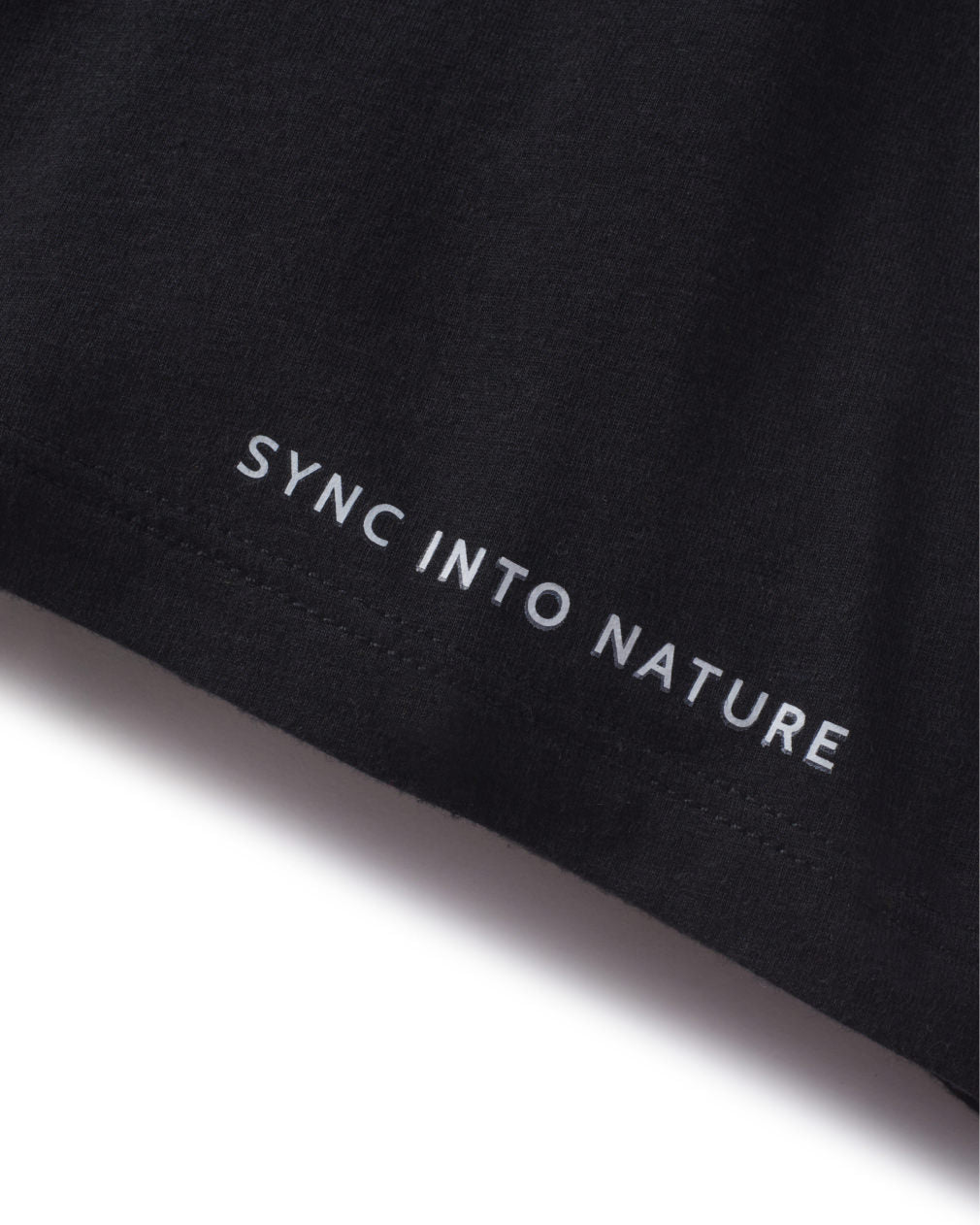 Close-Up of “Sync into Nature” Text on Edge of Men’s Black Alpaca Wool Underwear – PAKA Apparel