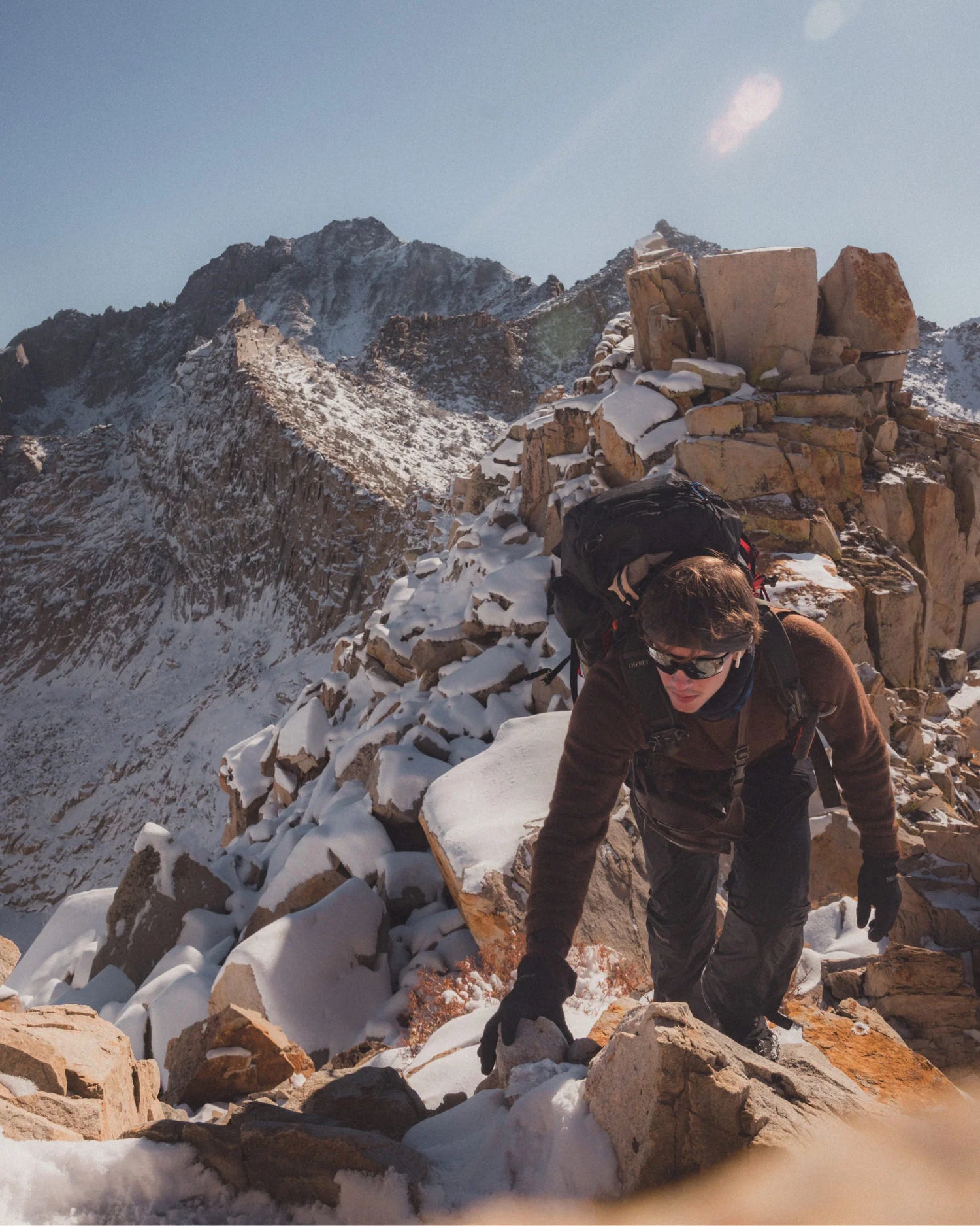 Hiker with Pack Climbing Snowy Mountain in The Hoodie Cocoa Dark Brown Alpaca Sweater with Hood – PAKA Apparel
