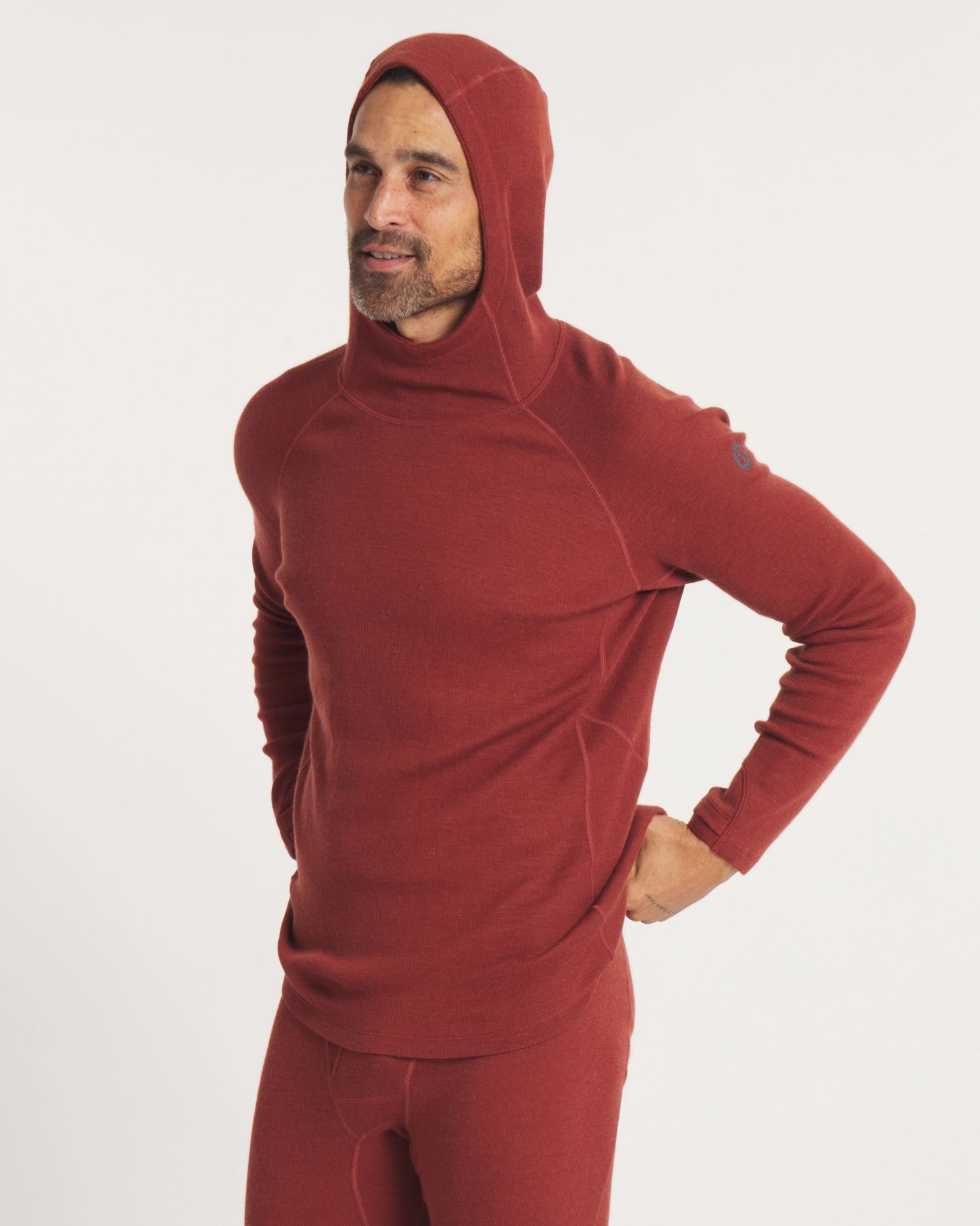 Model with Hood Up on Clay Red Men's Natural Fiber Thermal Hoodie Baselayer – PAKA Apparel