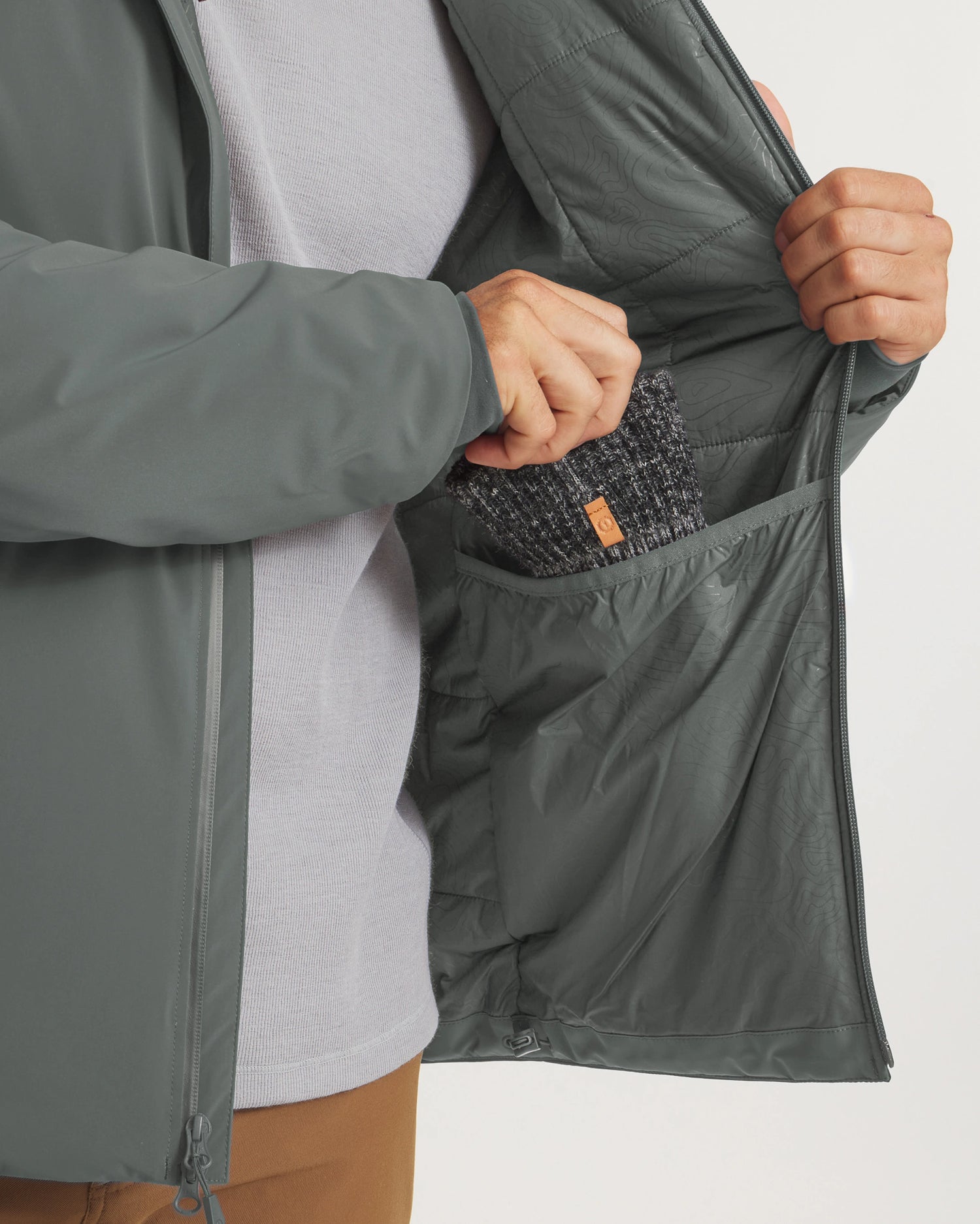 Close-Up of Men’s Apu Parka in Eucalyptus Green Opened to Show Interior Pocket and Insulated Winter Lining – PAKA Apparel