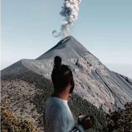 A man looking at a volcano 