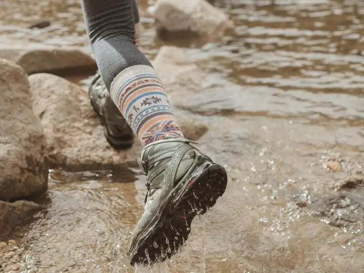 Our alpaca Inca socks in action across a river