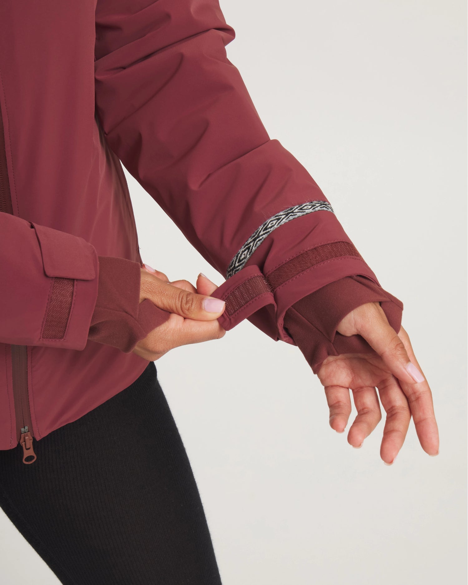 Close-Up of Thumbholes and Adjustable Wrist Straps on Women's Apu Parka in Burgundy – PAKA Apparel