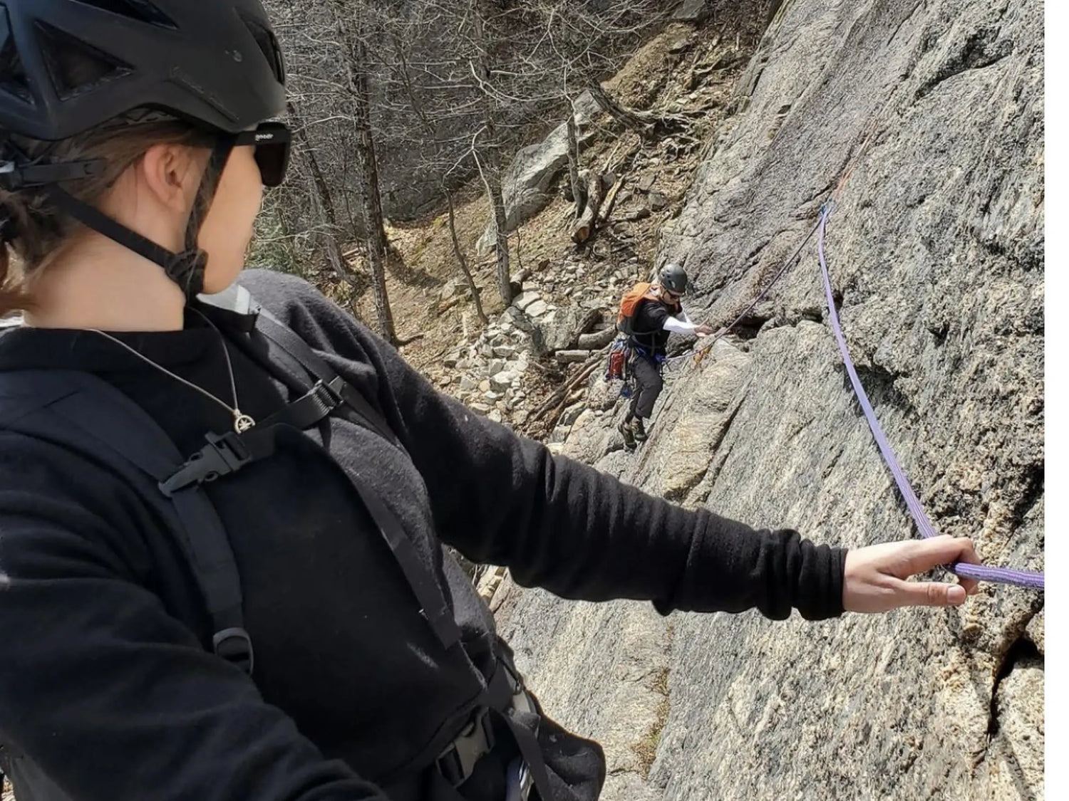 Woman climbing in black breathe zip hoodie 