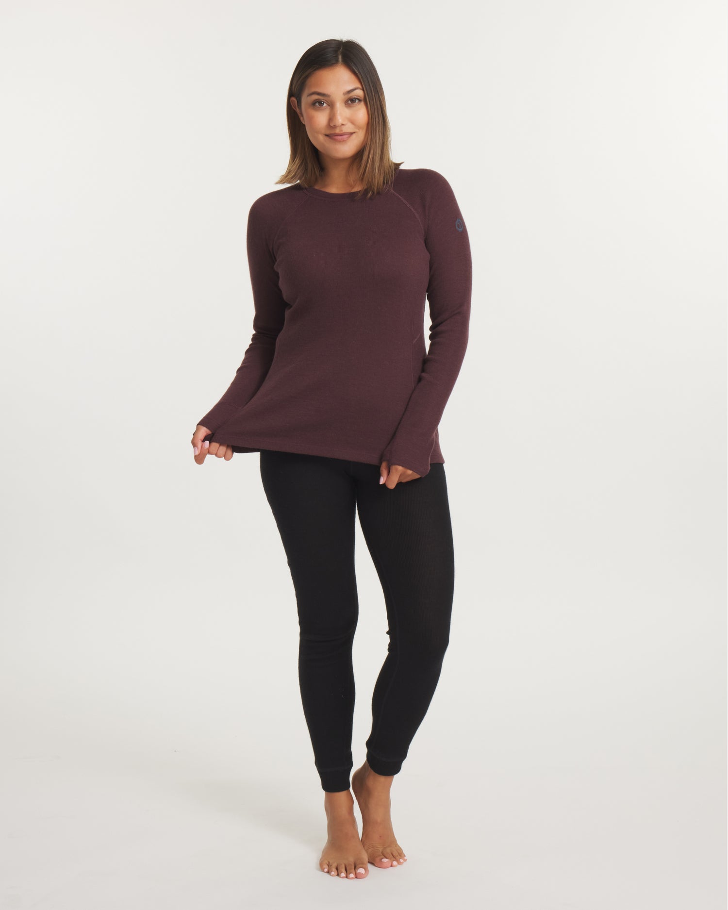 Front full-length view of Women’s Thermal Crew top in uva showing slim fit, raglan sleeves and thumbholes on white background