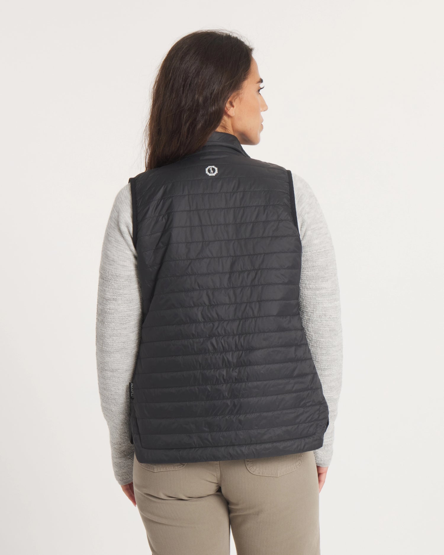 Back of Model Wearing Mayu Ultralight Packable Puffer Vest in Black – PAKA Apparel