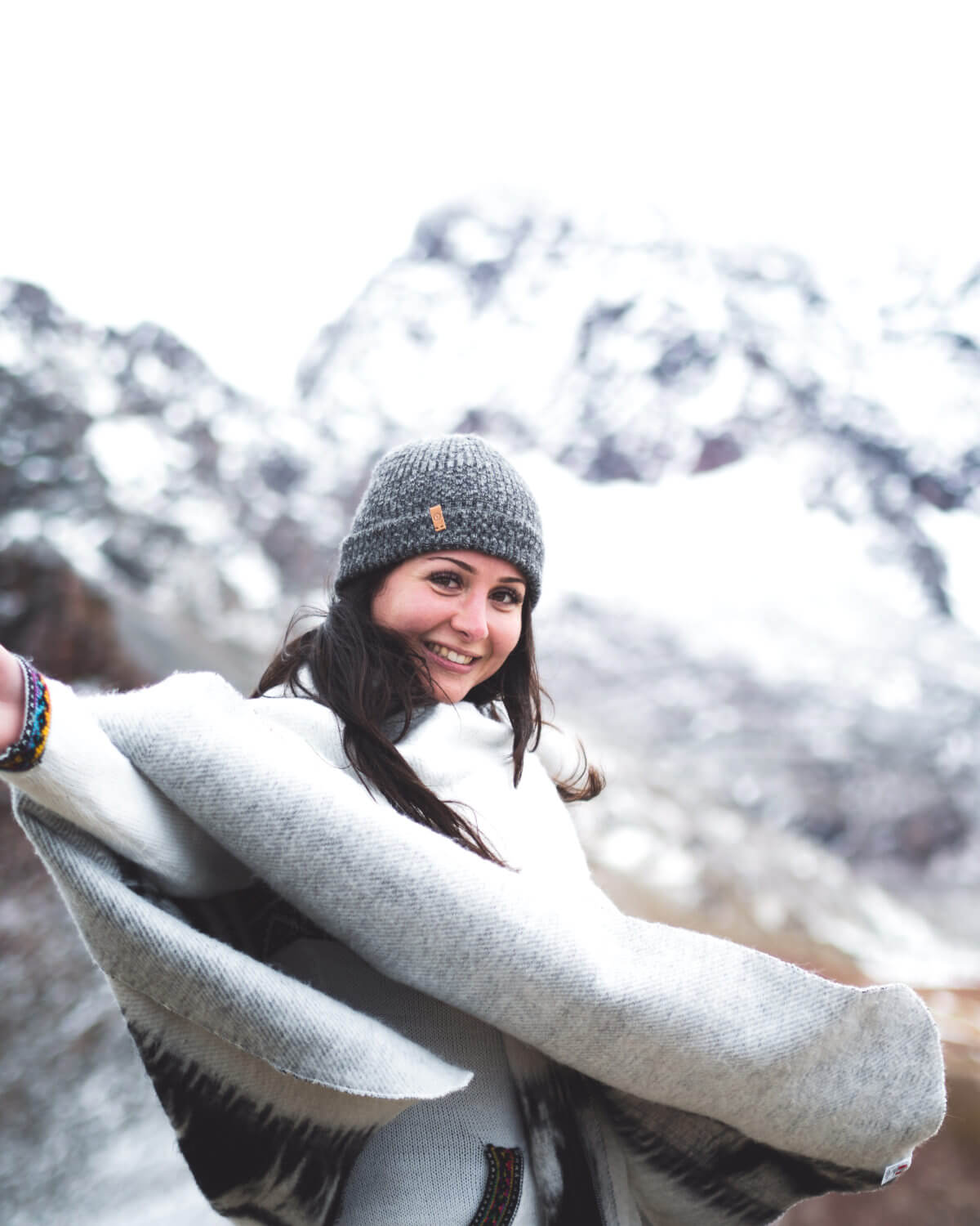 Paka Charcoal Beanie at Rainbow Mountain, Peru on woman model