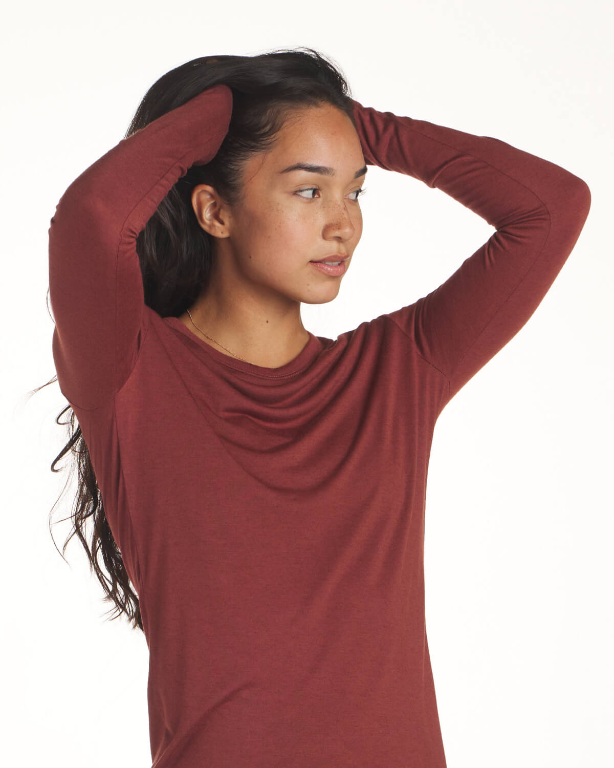 Red women's alpaca wool base layer on model