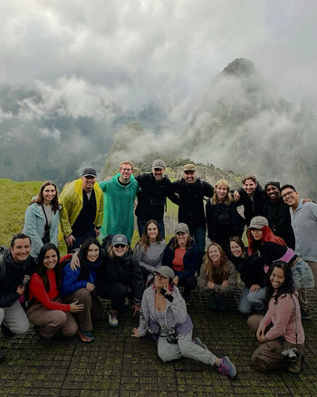 Paka team takes a picture with mystical looking Machu Picchu in the background