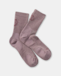 Flat lay of Trail 3/4 crew socks in Quail dusty mauve showing ribbed cuffs and crew length on a light gray background