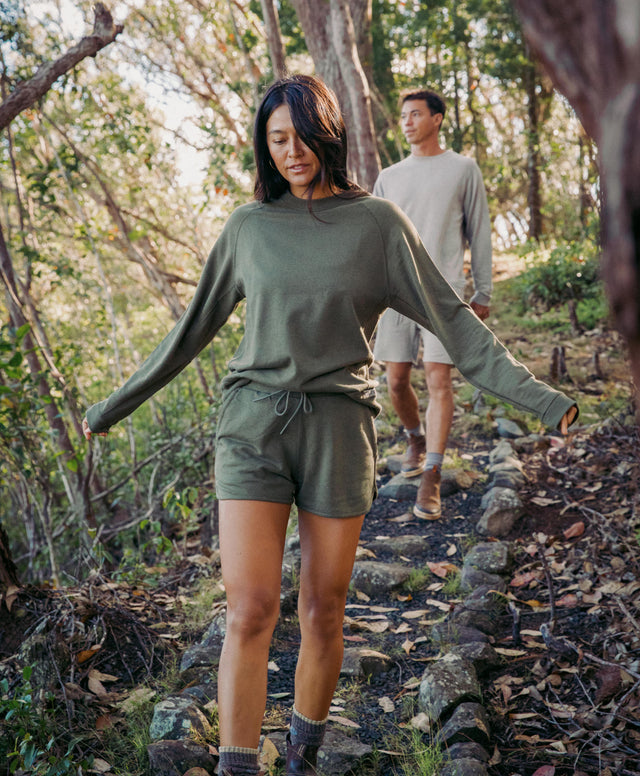 A couple walking in the nature in their Terry alpaca gear