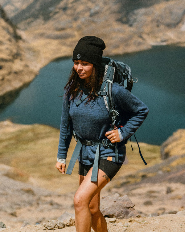 Woman wearing the original crew in the mountains
