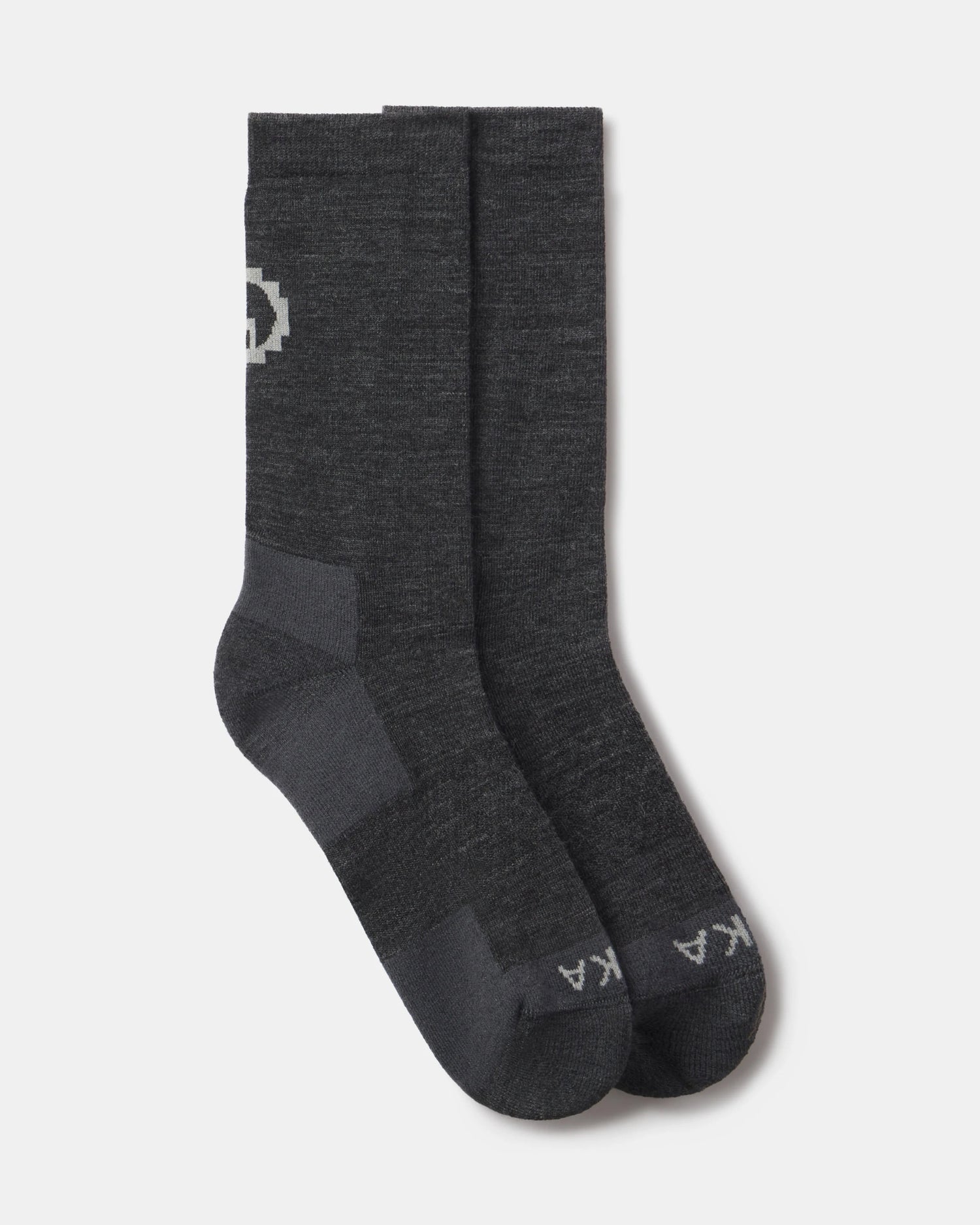 Pair of dark gray socks with a logo on a light gray background