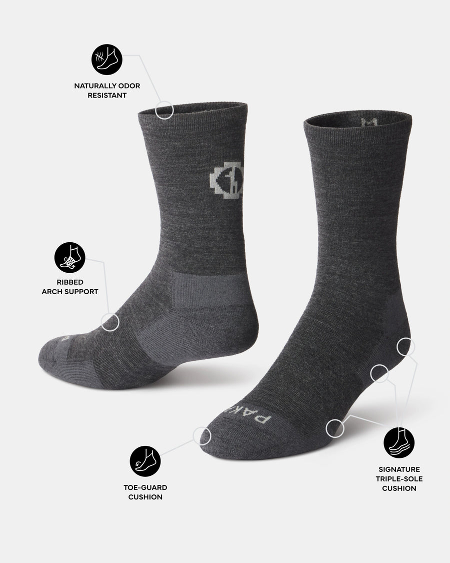Dark grey socks with features highlighted on a white background