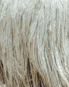 A long white alpaca fleece on an alpaca