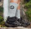 Best alpaca socks in light grey worn by hiker in hiking shoes