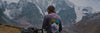 A man in his purple Explore Peru Long sleeve in the Andes mountains 