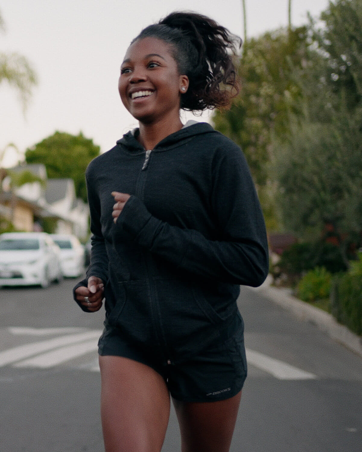 A woman wearing a Breathe Women's Full zip running