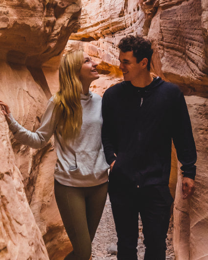 A couple wearing our Breathe garments exploring a canyon