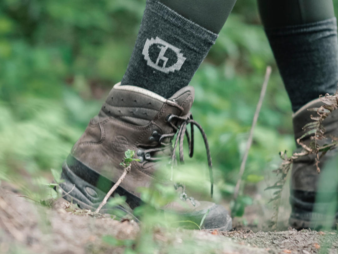 Our green alpaca socks outdoors. The Paka logo is visible