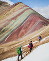 Three people backpacking on the rainbow mountain