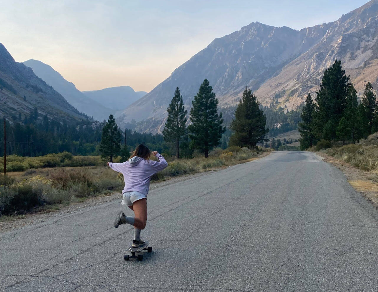 Woman skateboarding while wearing alpaca activewear