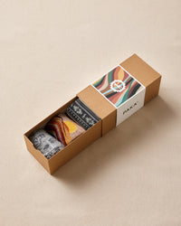 Box of socks with a colorful label on a beige background