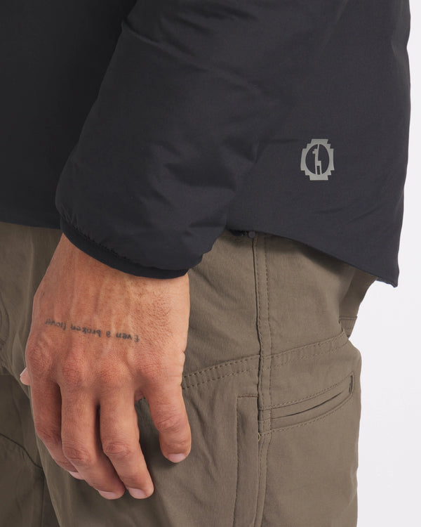 Side Waist View of Apu Men's Black Ethical Lightweight Puffer Jacket with Temperature Regulating PAKAFILL® Alpaca Insulation – PAKA Apparel