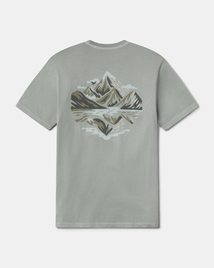 Gray t-shirt with mountain graphic on a white background