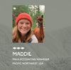 Maddie smiling with a brown alpaca on a forest trail, PAKA accounting manager, Pacific Northwest, USA
