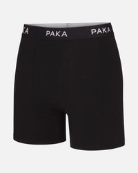 Front view of Essential Boxer Brief in black with PAKA elastic waistband and mid-thigh length on white background
