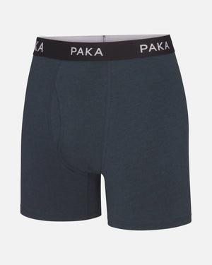 Front view of men’s navy boxer brief with PAKA-branded black waistband and contoured front pouch on light gray background