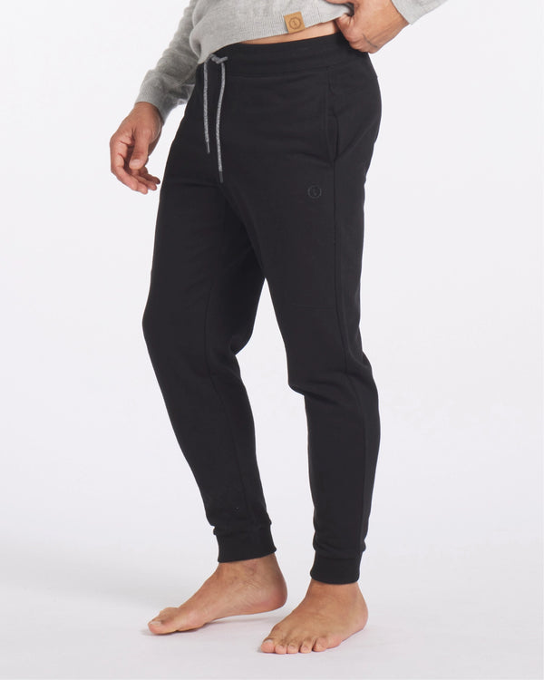 Lower Half of Model Wearing Organic Pima Cotton, Tencel and Alpaca Men’s Joggers in Black – PAKA Apparel