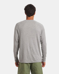 Back view of Men’s Sol Crew alpaca long-sleeve UPF sun shirt in heather grey showcasing raglan sleeves and relaxed fit on plain light background