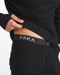 Midriff of Man Revealing "PAKA" Text on Waistband of Black Thermal Baselayer Pants – PAKA Apparel