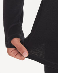 Hand Tugging on Waist of Men's Alpaca Thermal Crew Baselayer Shirt in Black – PAKA Apparel