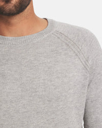 Front close-up of Men’s Ultralight Crew in ice heather grey worn by model, showing crew neck and raglan shoulder seam