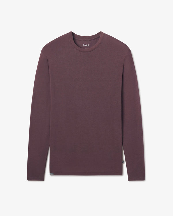 PAKA Men's Aire long-sleeve in Fig shirt on a light gray background