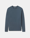 Blue long-sleeve shirt on a light gray background