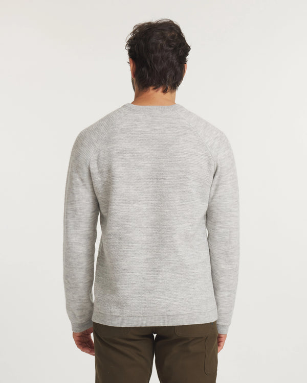 Man wearing a  Light Grey sweater on a white background