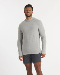 Model in Heather Grey Sol Men's Lightweight and Breathable Sun Hoodie – PAKA Apparel