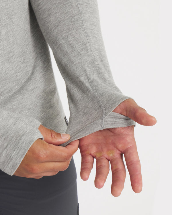 Hands Through Thumbholes of Sol Men's UPF Sun Protection Hoodie in Heather Grey – PAKA Apparel