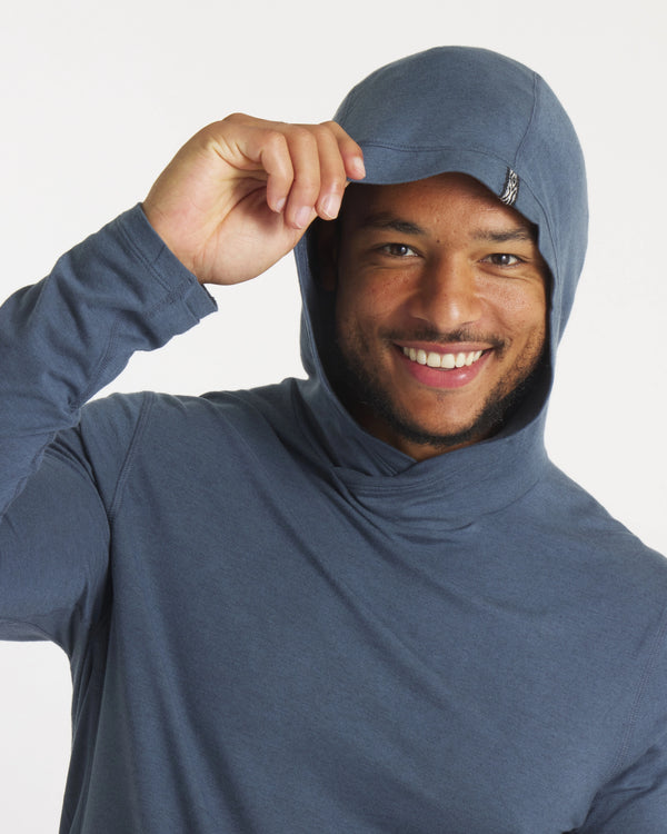 Model with Hand on Raised Hood of Sol Men's Sun Hoodie in Navy – PAKA Apparel