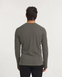 Back view of Men’s Thermal Crew alpaca baselayer on model showing raglan shoulder seams and thermal knit in Andean Moss on white background