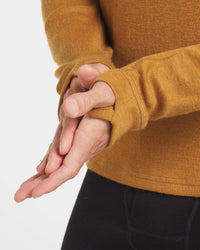 Close Up of Hands and Thumb Holes on Men’s Golden Brown Alpaca Wool Thermal Baselayer Shirt – PAKA Apparel