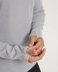 Close-Up of Hands Through Thumbholes on Men's Thermal Crew Baselayer Shirt in Silver Grey – PAKA Apparel